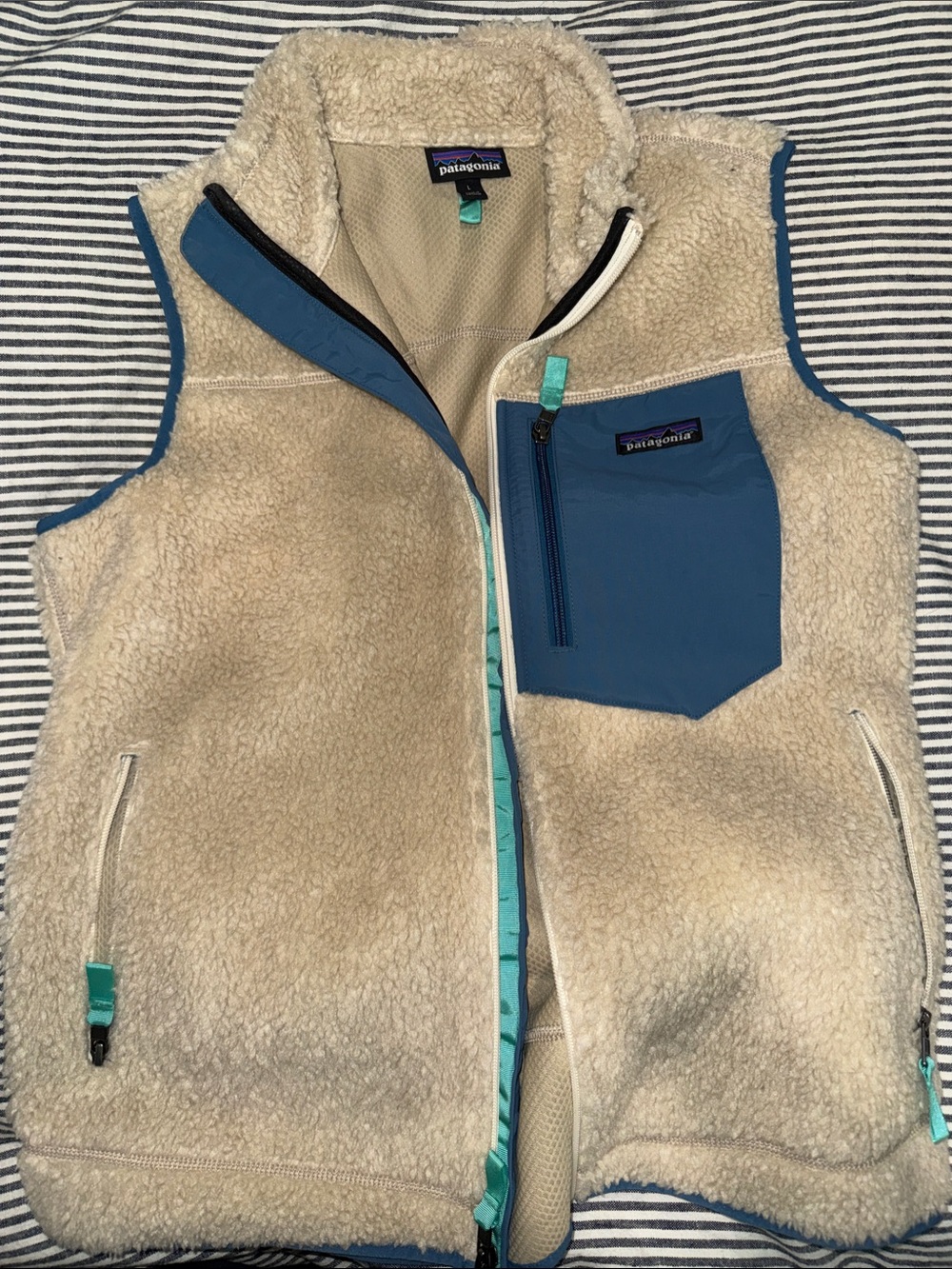 Patagonia Cream Sherpa Vest with Blue Pocket and Teal Trim